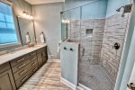 Large suite restroom with double vanity and walk in shower